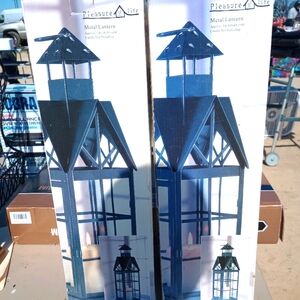 Two used once lanterns with candles